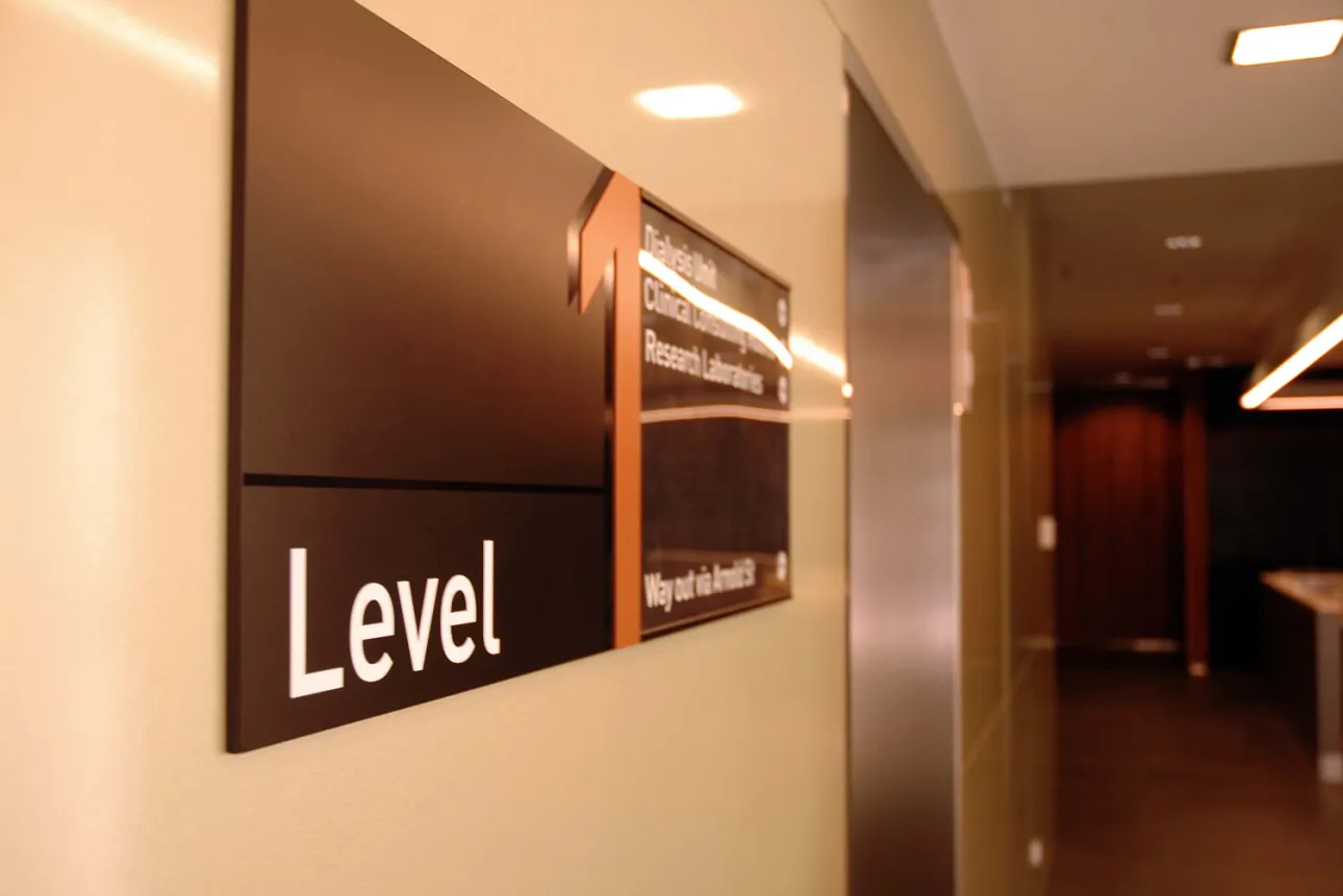 Level signage in hospital corridor